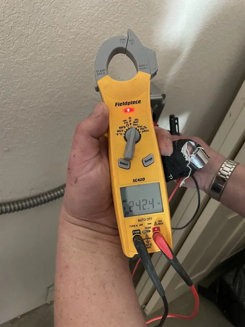 Voltage testing with clamp meter during Ceiling Fan Installation in Bedford Heights